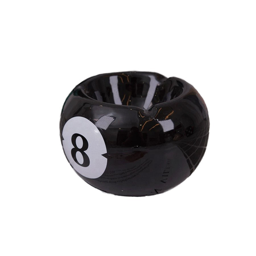 Bittchaser Supply Co. black ceramic 8 ball billiard ashtray with a glossy glazed finish for tabletop use.