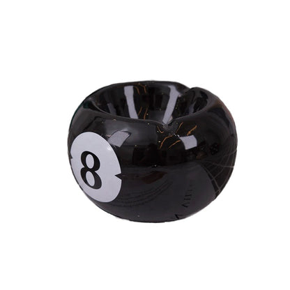Bittchaser Supply Co. black ceramic 8 ball billiard ashtray with a glossy glazed finish for tabletop use.