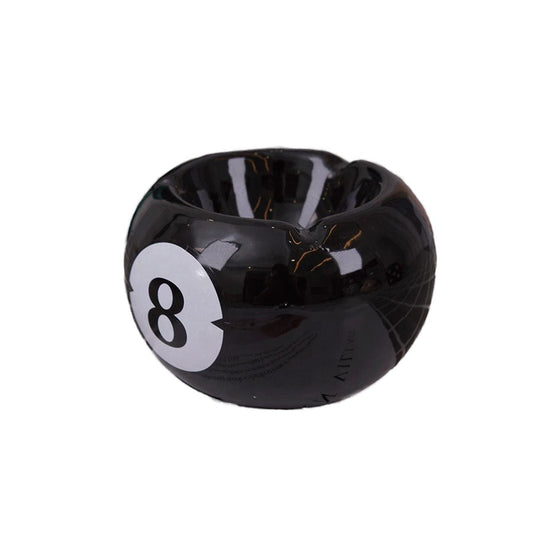 Bittchaser Supply Co. black ceramic 8 ball billiard ashtray with a glossy glazed finish for tabletop use.